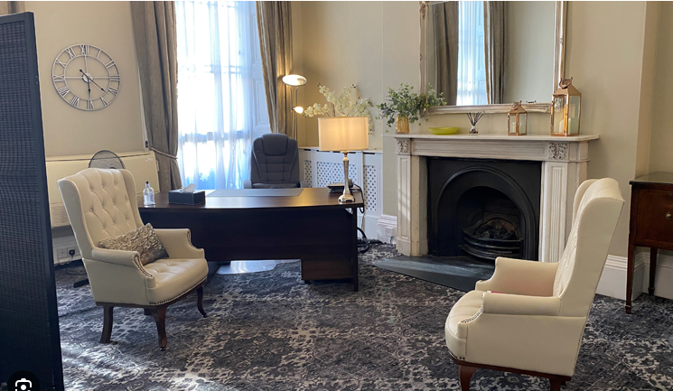 Private consulting room with marble fireplace at 10 Harley Street